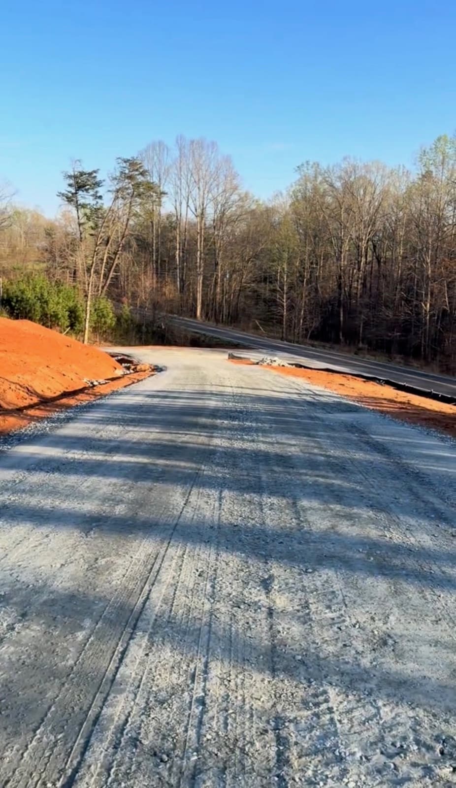 Fresh gravel driveway graded down to the road