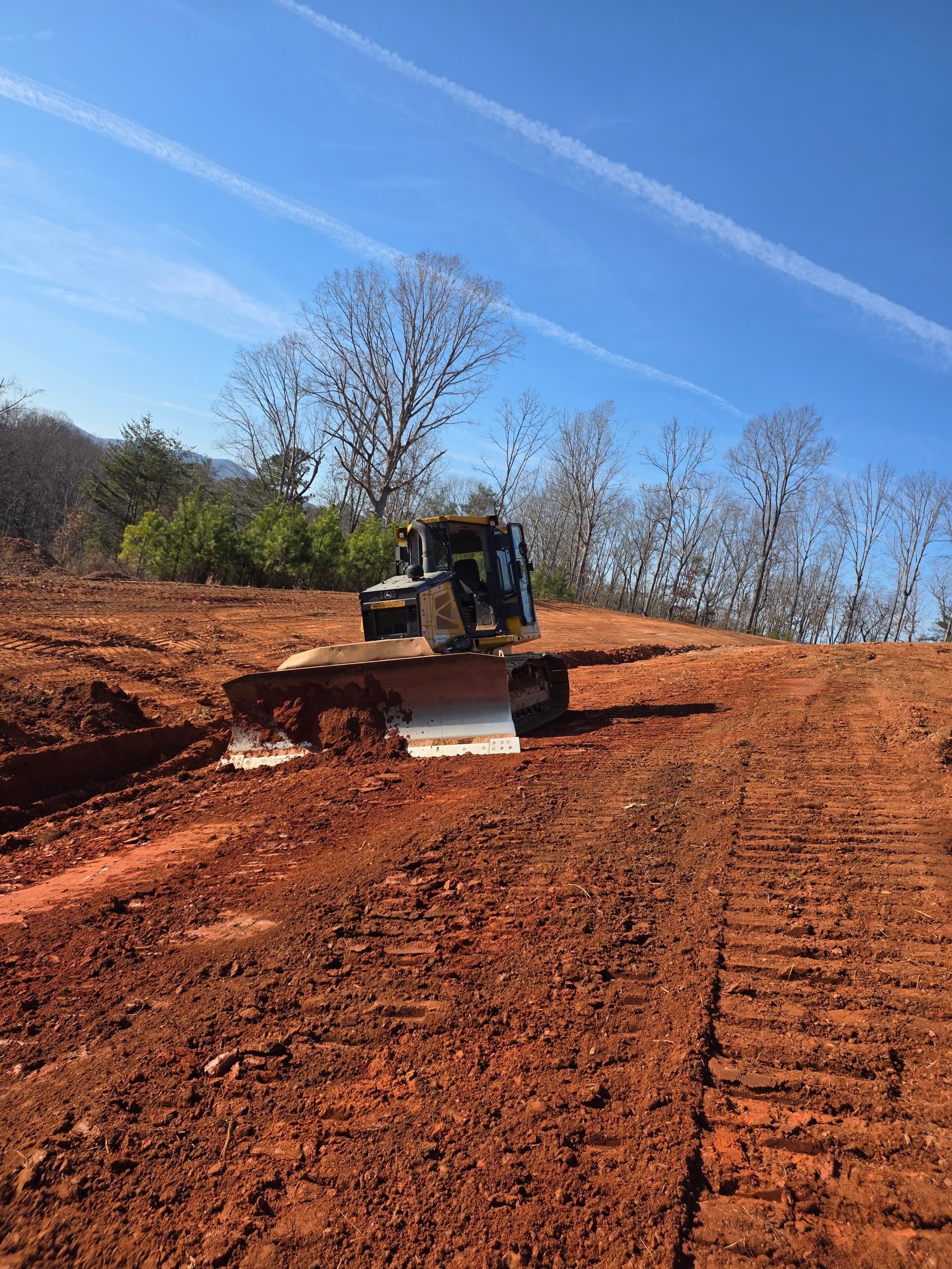 Bulldozer grading red clay