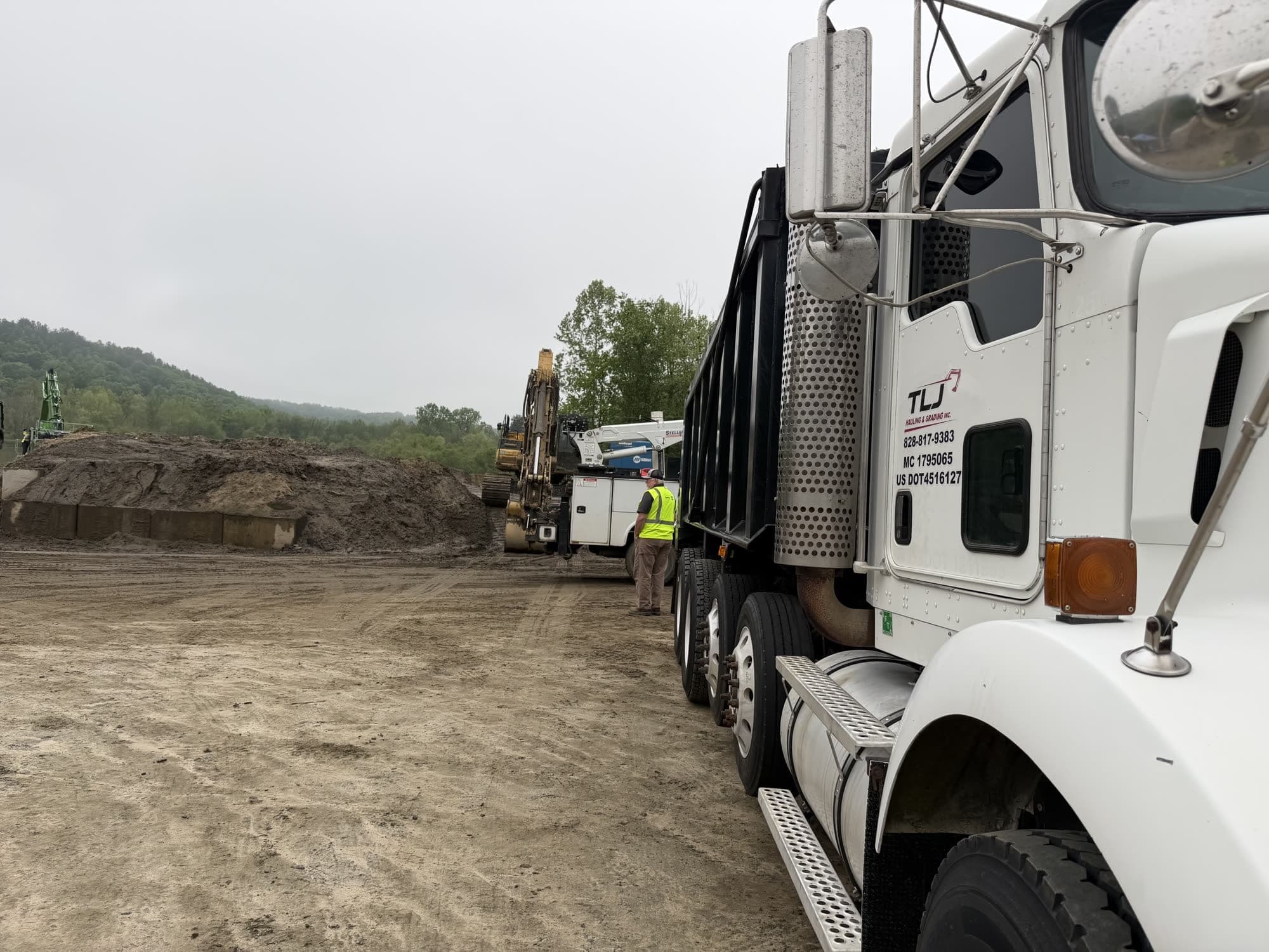 TLJ dump truck on a job site