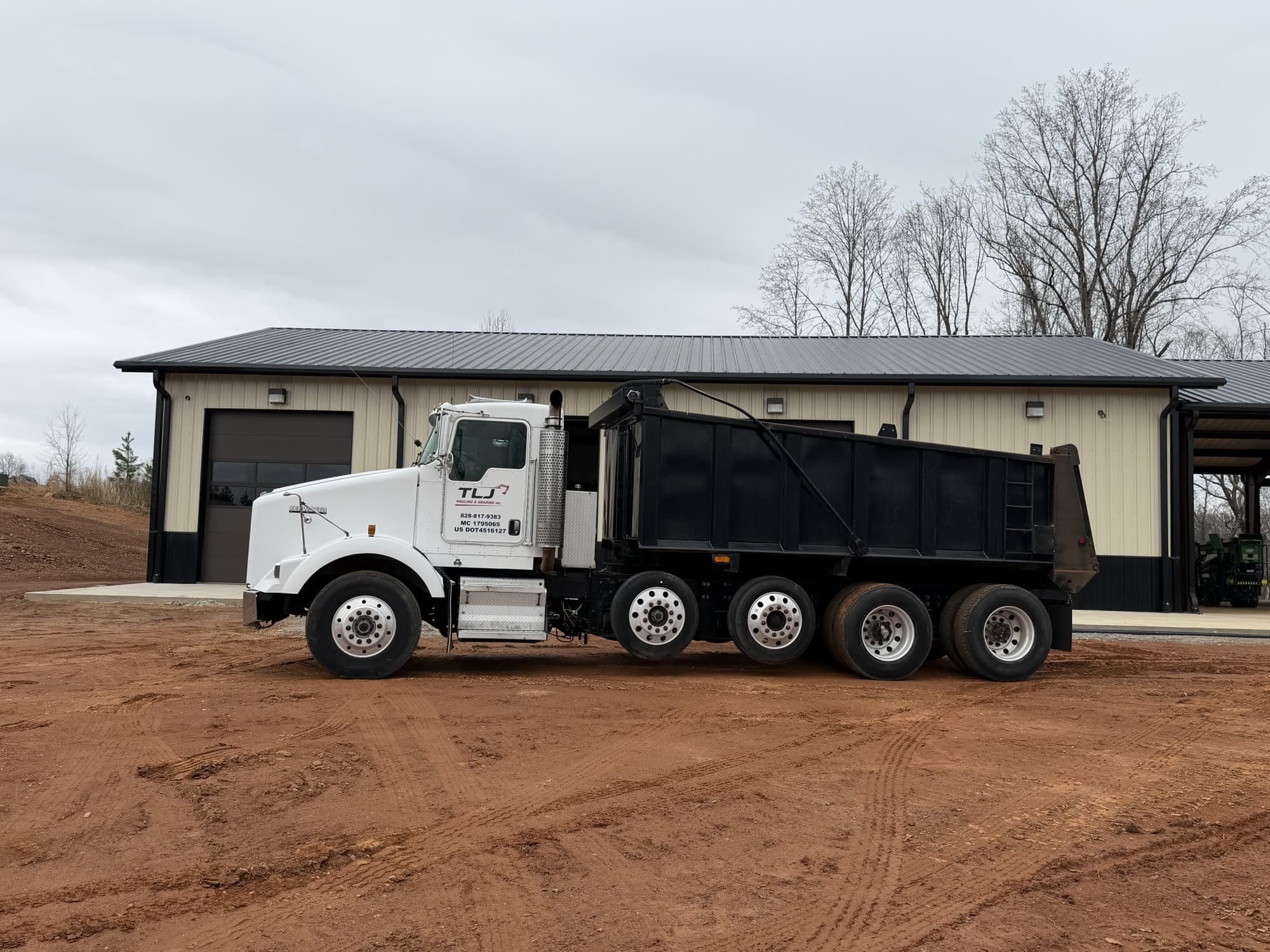 TLJ Kenworth dump truck with company lettering on the door